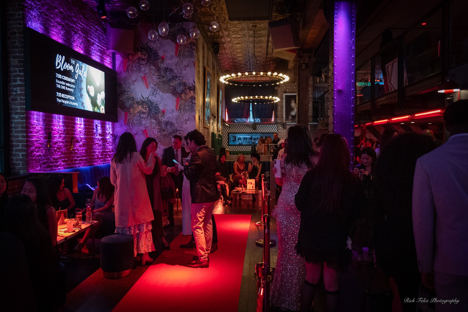 Guests mingling beside the illuminated runway